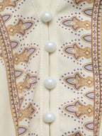 Daphné – Robe courte beige imprimée à manches longues avec ceinture élégante à nouer