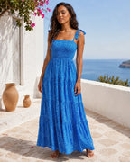 Ximena – Vestido midi de mujer azul cielo estampado, con tirantes anudados y falda fluida elegante