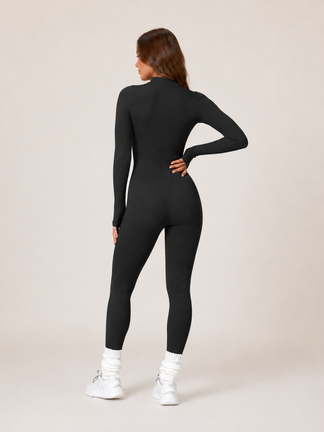 Elowen Naadloze Sport Jumpsuit met Halve Rits, Ribstructuur en Lange Mouwen voor Dames