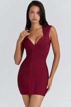 Clémence – Robe bandage courte rose sans manches à décolleté plongeant sculptant