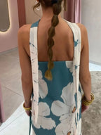 Élodie – Vestido largo palabra de honor azul petróleo con grandes flores blancas y corte fluido