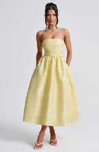 Ursula – Vestido midi de mujer amarillo limón en jacquard floral, con corpiño plisado elegante